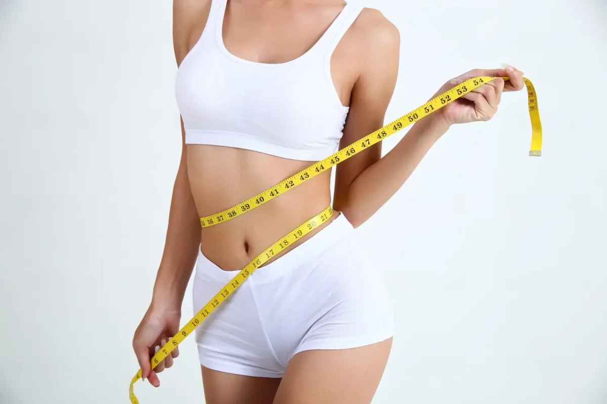 young-woman-with-beautiful-body-measure-tape-1-1200x800.webp